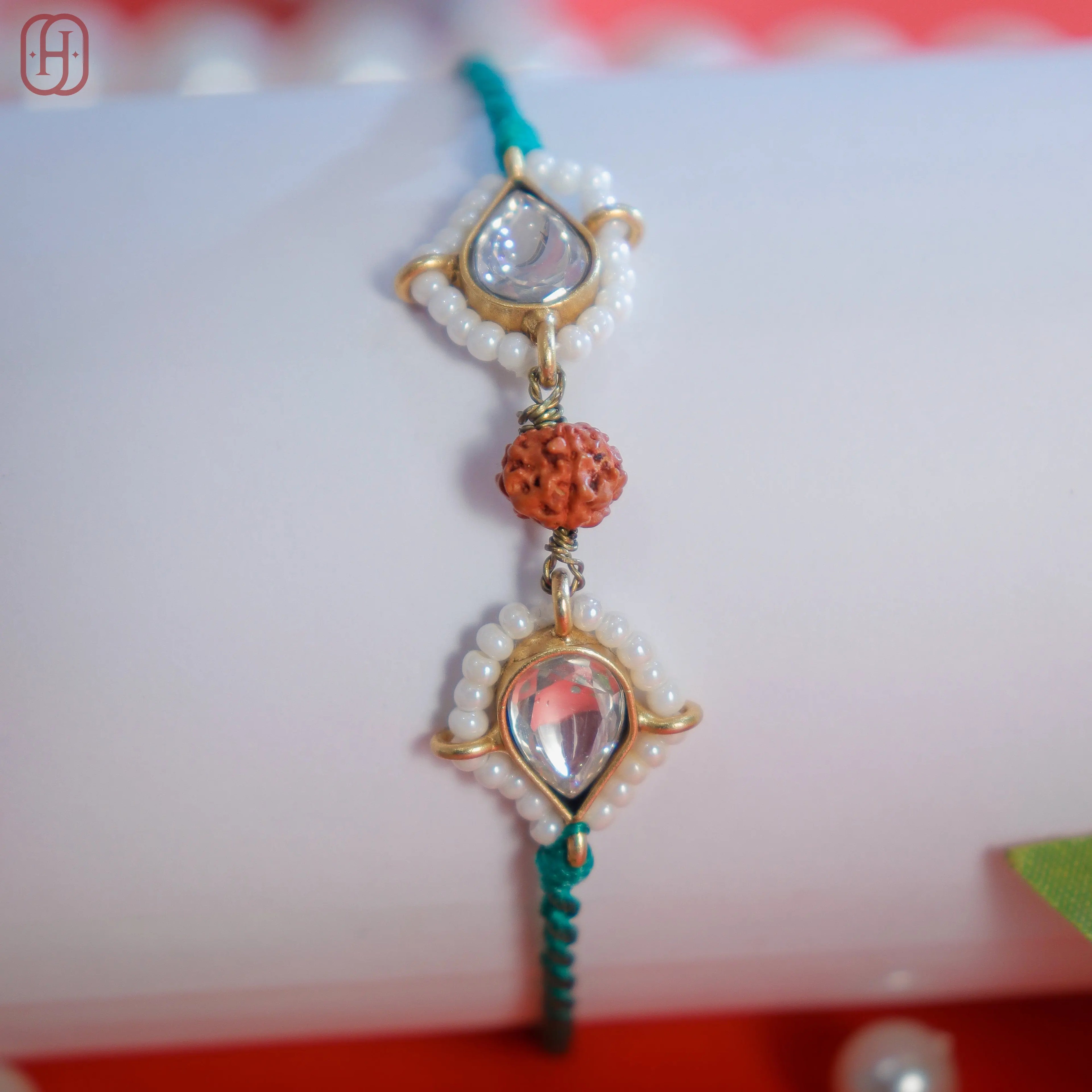 Designer Rudraksha Rakhi with 92.5 Silver Accents.