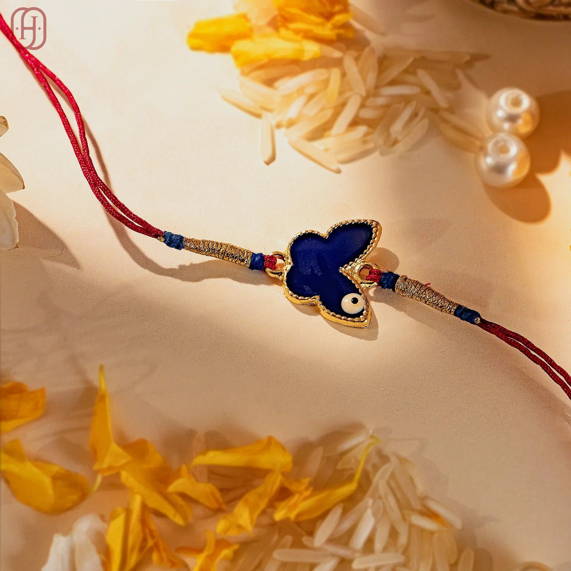 Hardik Jewels Butterfly Silver Rakhi with Blue Enamel.