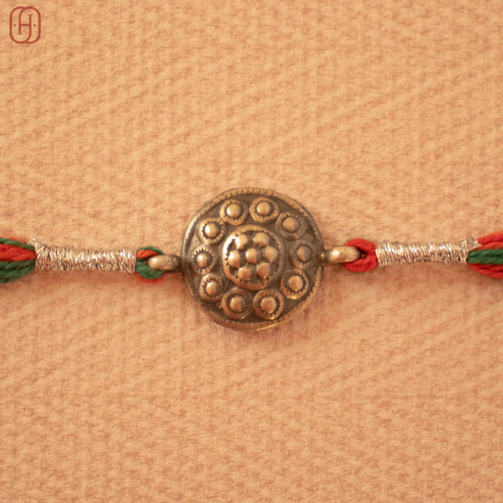Hardik Jewels Handcrafted Silver Rakhi - Elegant Design.
