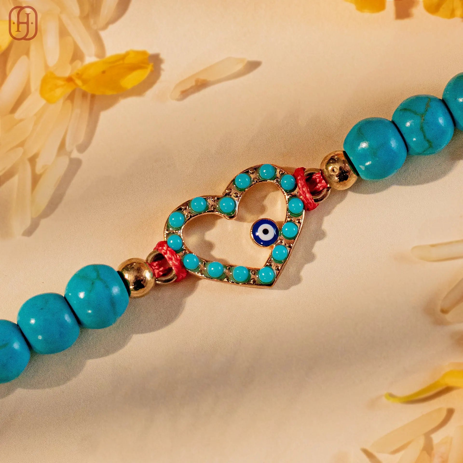 Hardik Jewels Heart Evil Eye Silver Rakhi with Blue Beads.