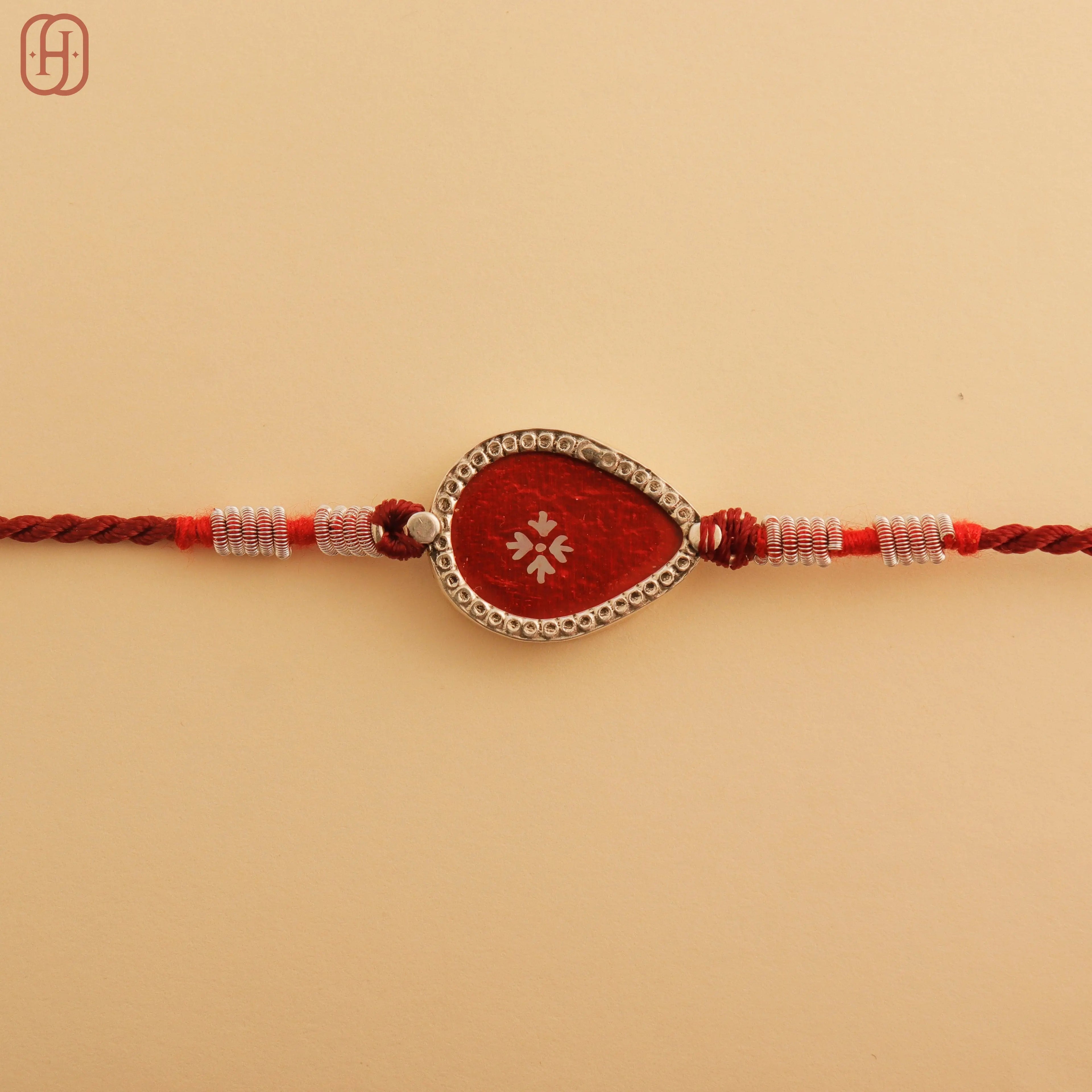 Hardik Jewels Red Enamel Teardrop Rakhi - Handcrafted Elegance.