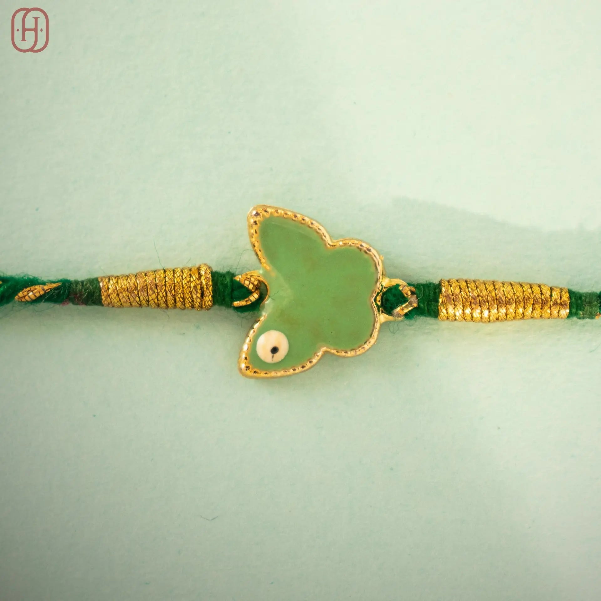 Hardik Jewels Silver Enamel Rakhi Online - Elegant Butterfly Design.