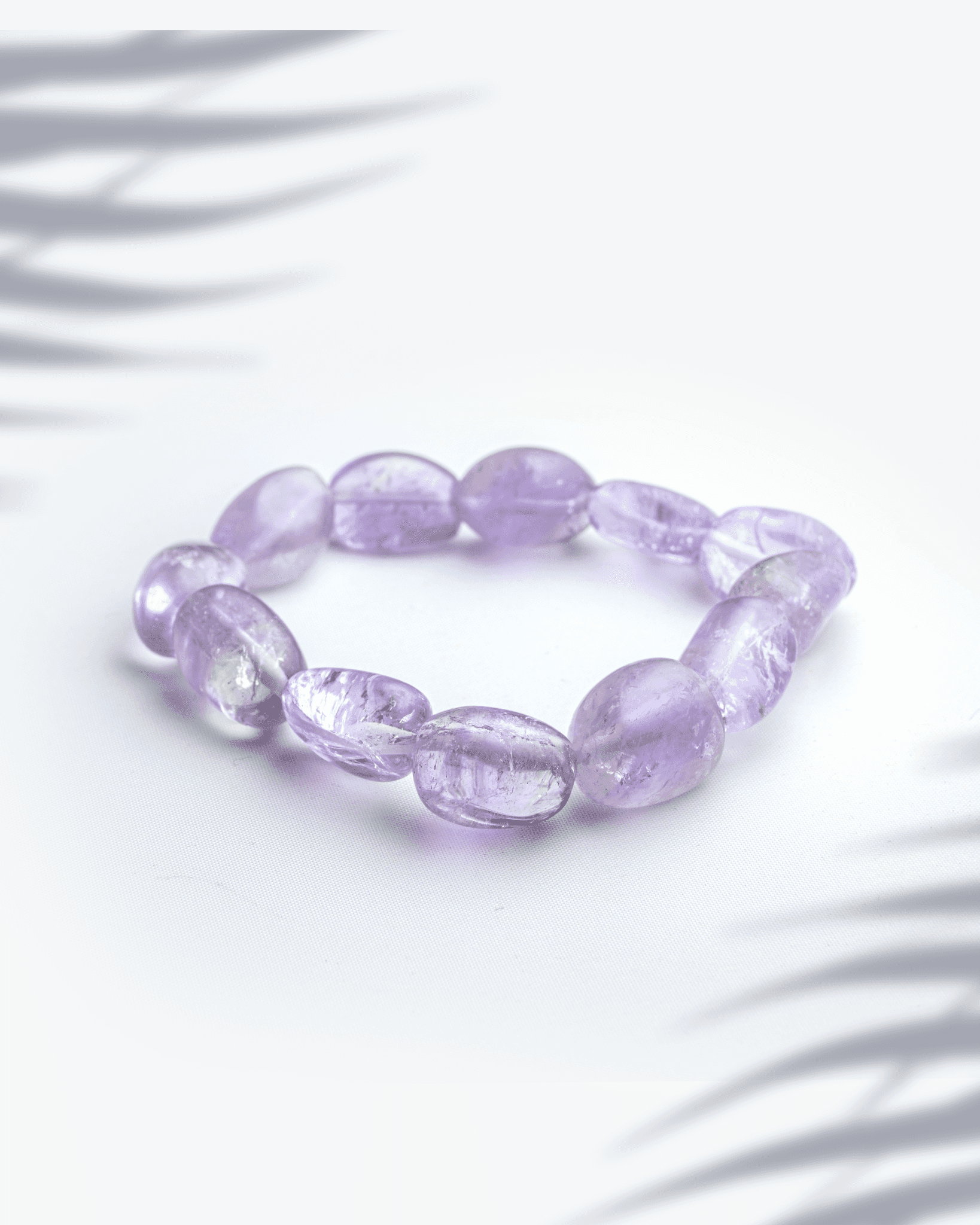 Natural amethyst gemstone bracelet featuring organic tumbled purple nugget beads for peace and spirituality.