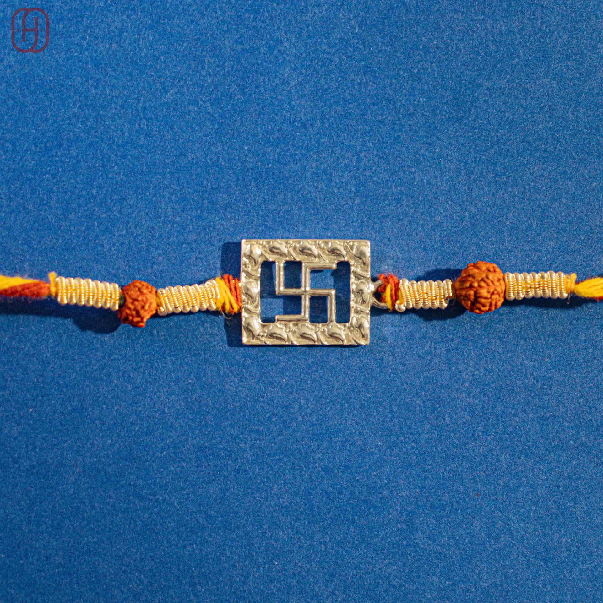 Silver Om Rakhi Online - Handcrafted by Hardik Jewels.