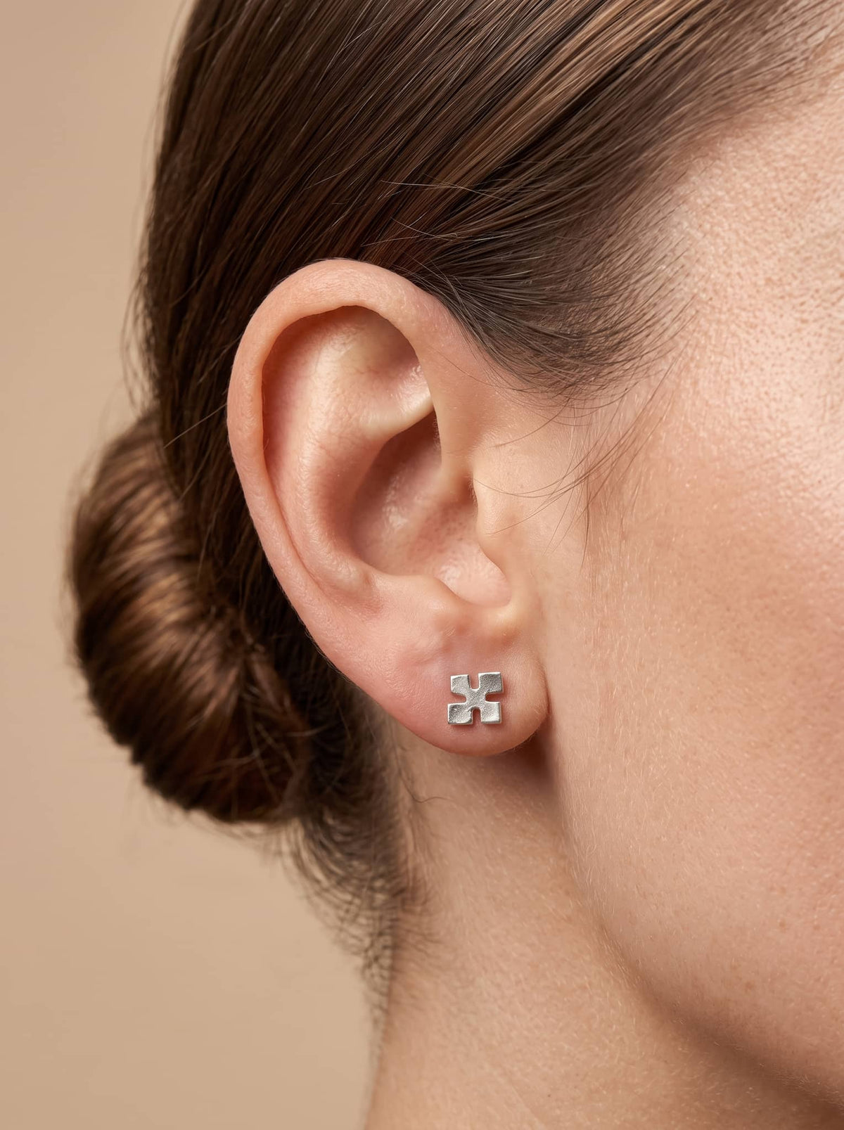 Minimal Cross Silver Stud Earrings - ear styling view - Hardik Jewels