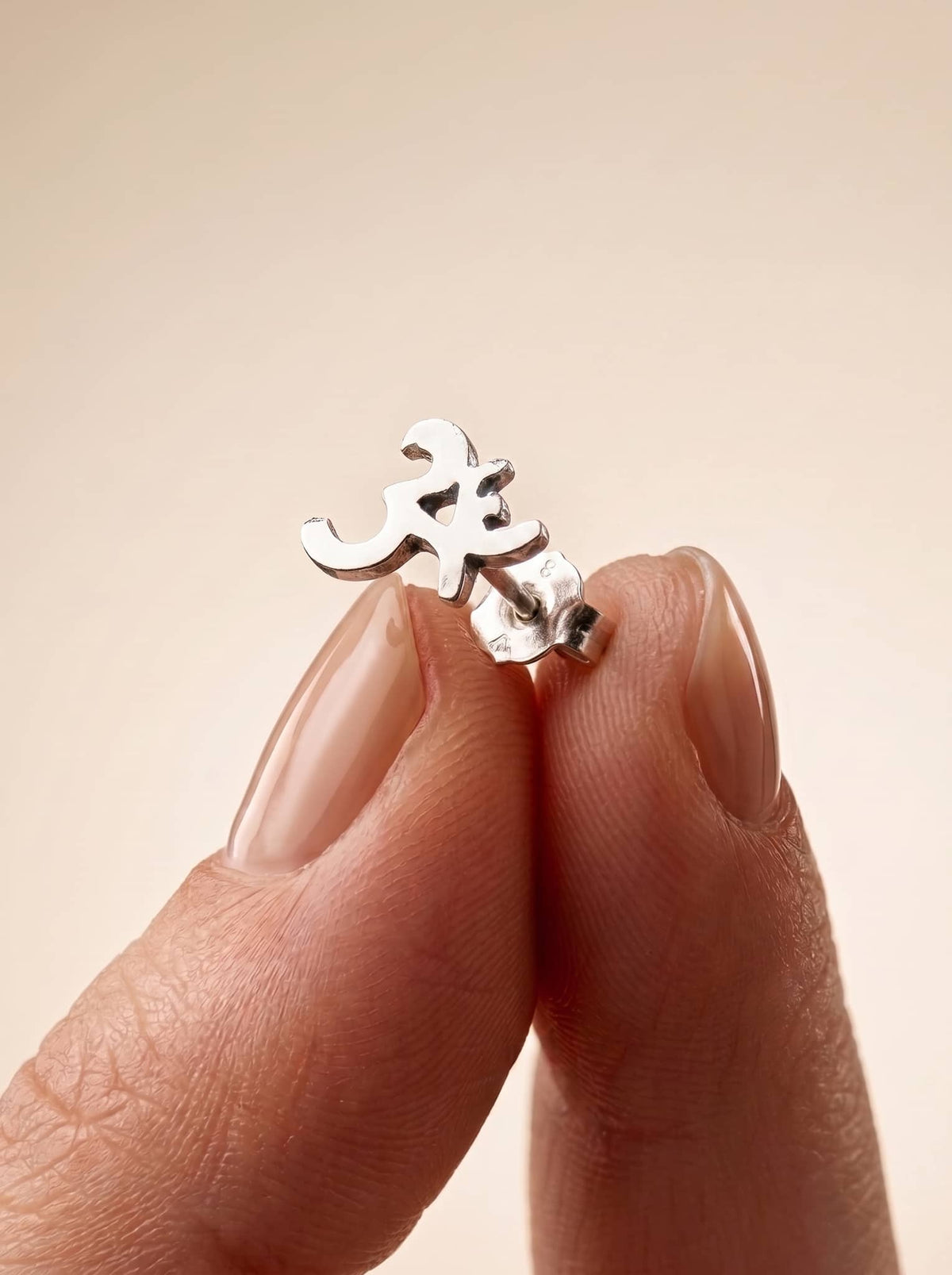 Om Symbol 92.5 Sterling Silver Stud Earrings - close-up detail view - Hardik Jewels