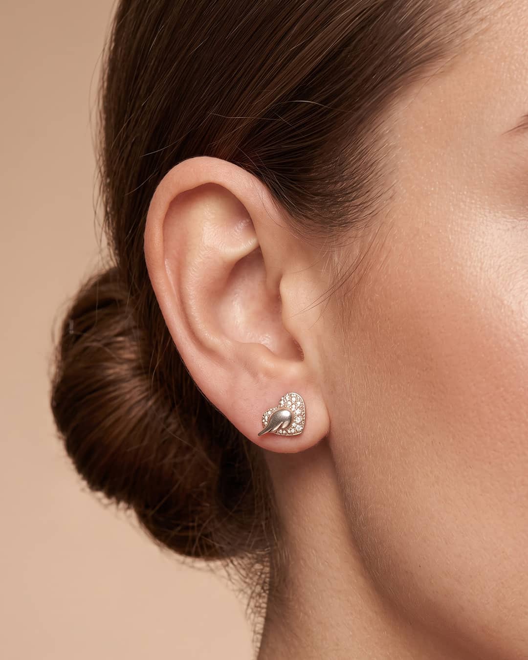 Mother of Pearl Heart Wing CZ Silver Stud Earrings - ear styling view - Hardik Jewels