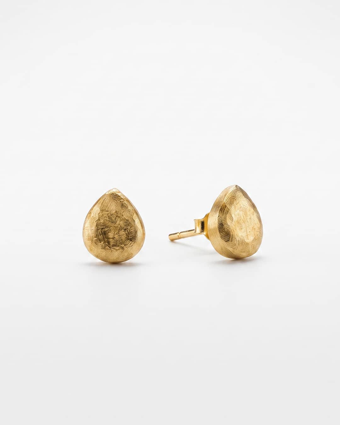 Golden Teardrop Textured Silver Stud Earrings - white background detail view - Hardik Jewels