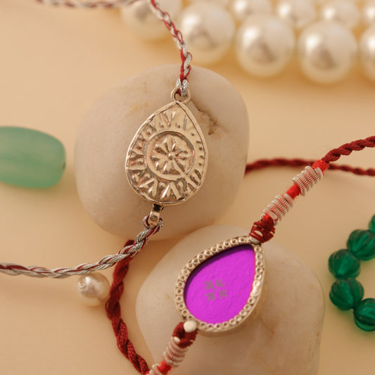 Hardik Jewels Teardrop Rakhi Design with Silver Charm.