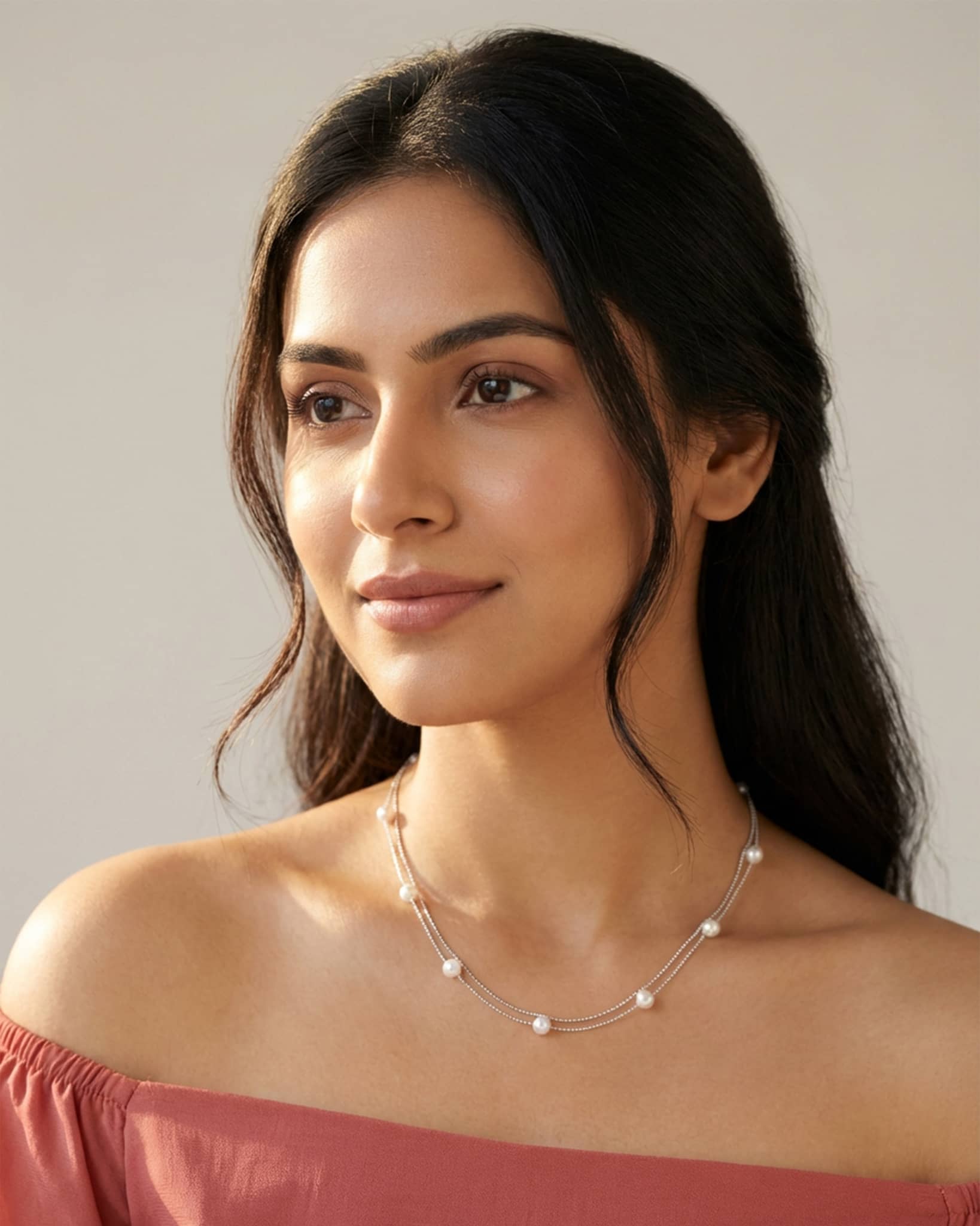 92.5 sterling silver double layer necklace featuring delicate chains with small white pearls.