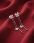 92.5 sterling silver drop earrings featuring cz studded interlocked loops and double pearl drops.
