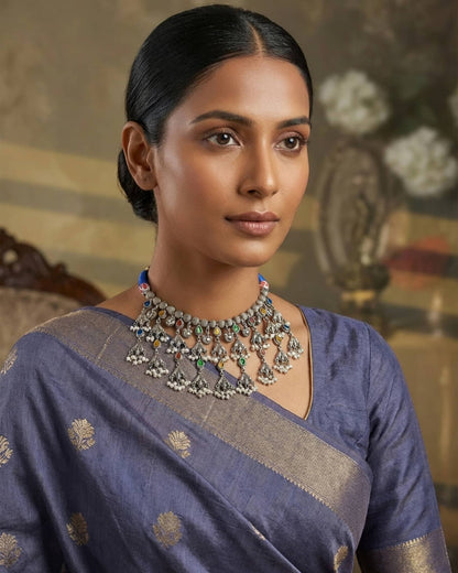 92.5 sterling silver hasli necklace featuring a tree of life pendant with multi colored stones.