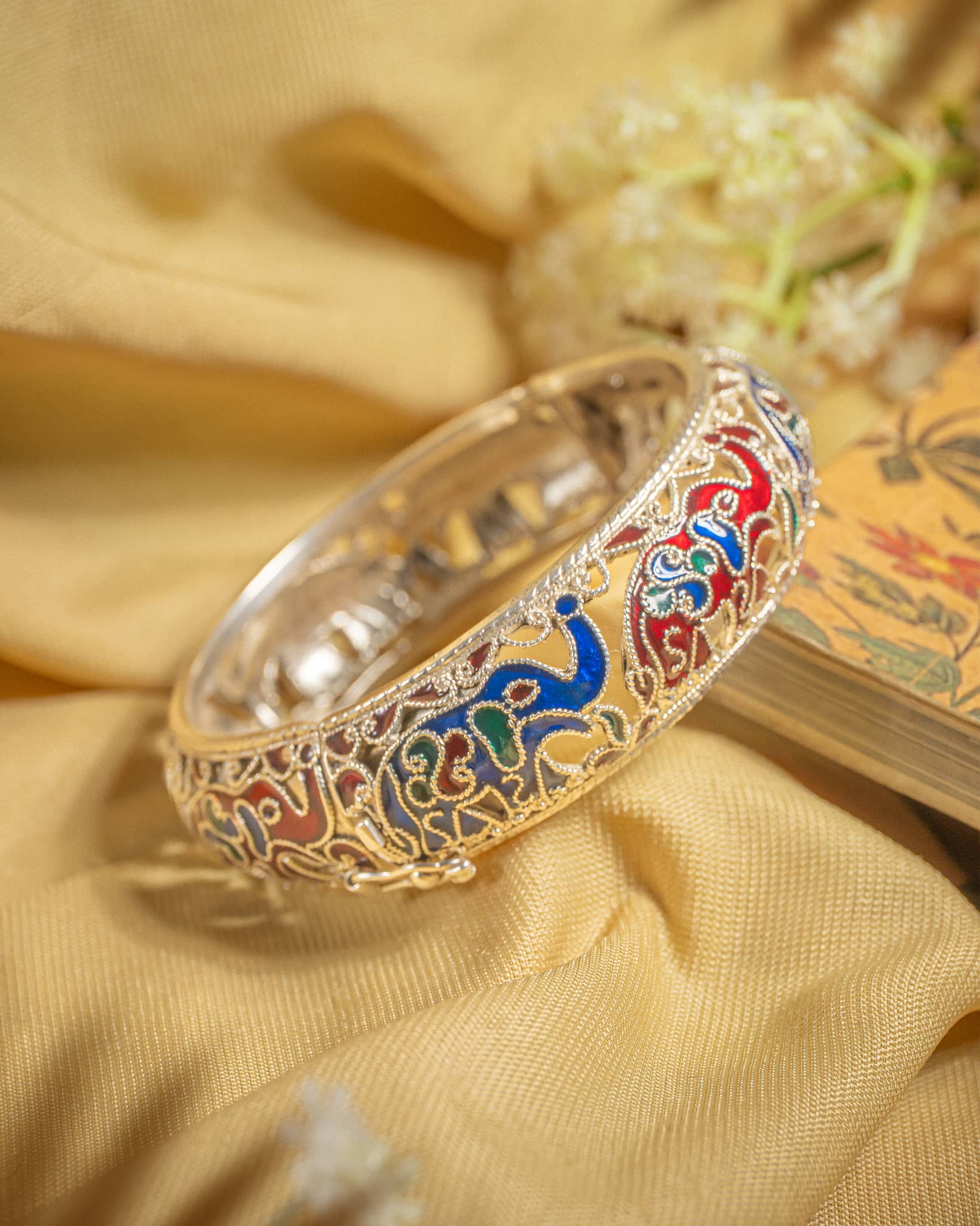92.5 sterling silver meenakari bangle featuring colorful enamel elephant motifs and filigree work.