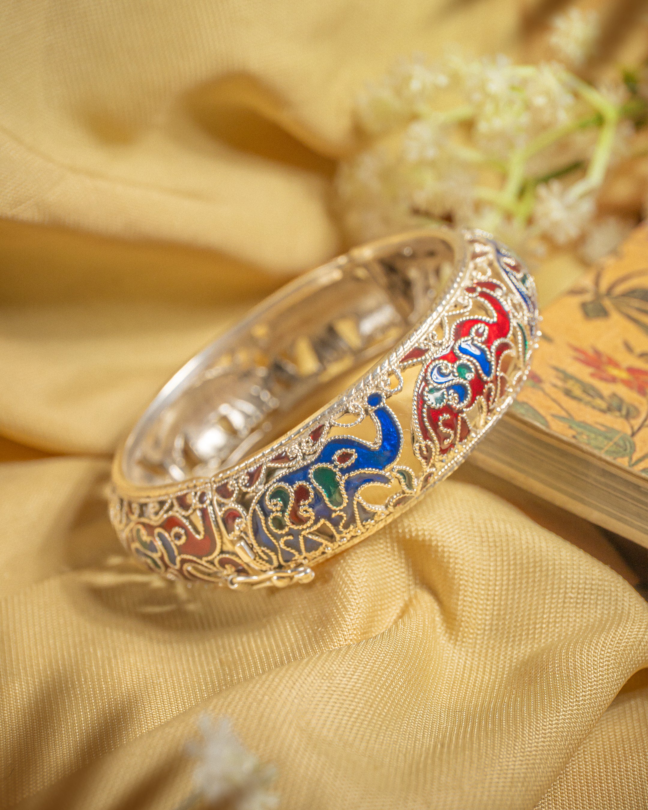 92.5 sterling silver meenakari bangle featuring colorful enamel elephant motifs and filigree work.