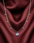 92.5 sterling silver necklace featuring a round pave evil eye pendant and stone station chain.