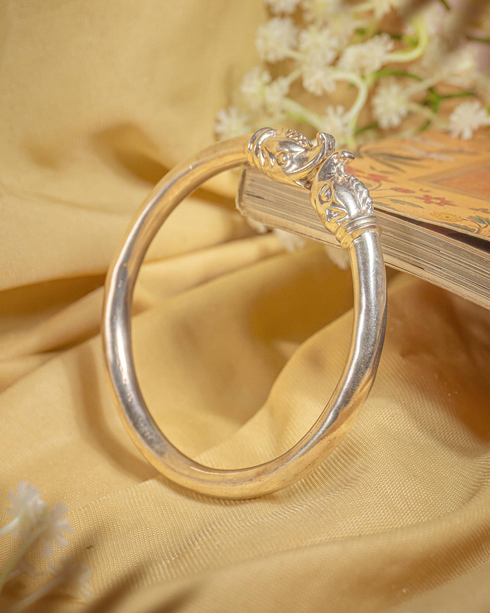 92.5 sterling silver open cuff kada featuring antique elephant head gajraj motifs.