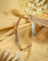 92.5 sterling silver slim hammered bangle featuring small multi-colored gemstones.