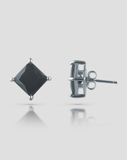 Front and side profile view of silver stud earrings featuring a square black cz stone in a 4-prong basket setting with push-back closures