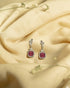 925 sterling silver drop earrings featuring a square cushion-cut ruby red stone surrounded by a white american diamond halo.
