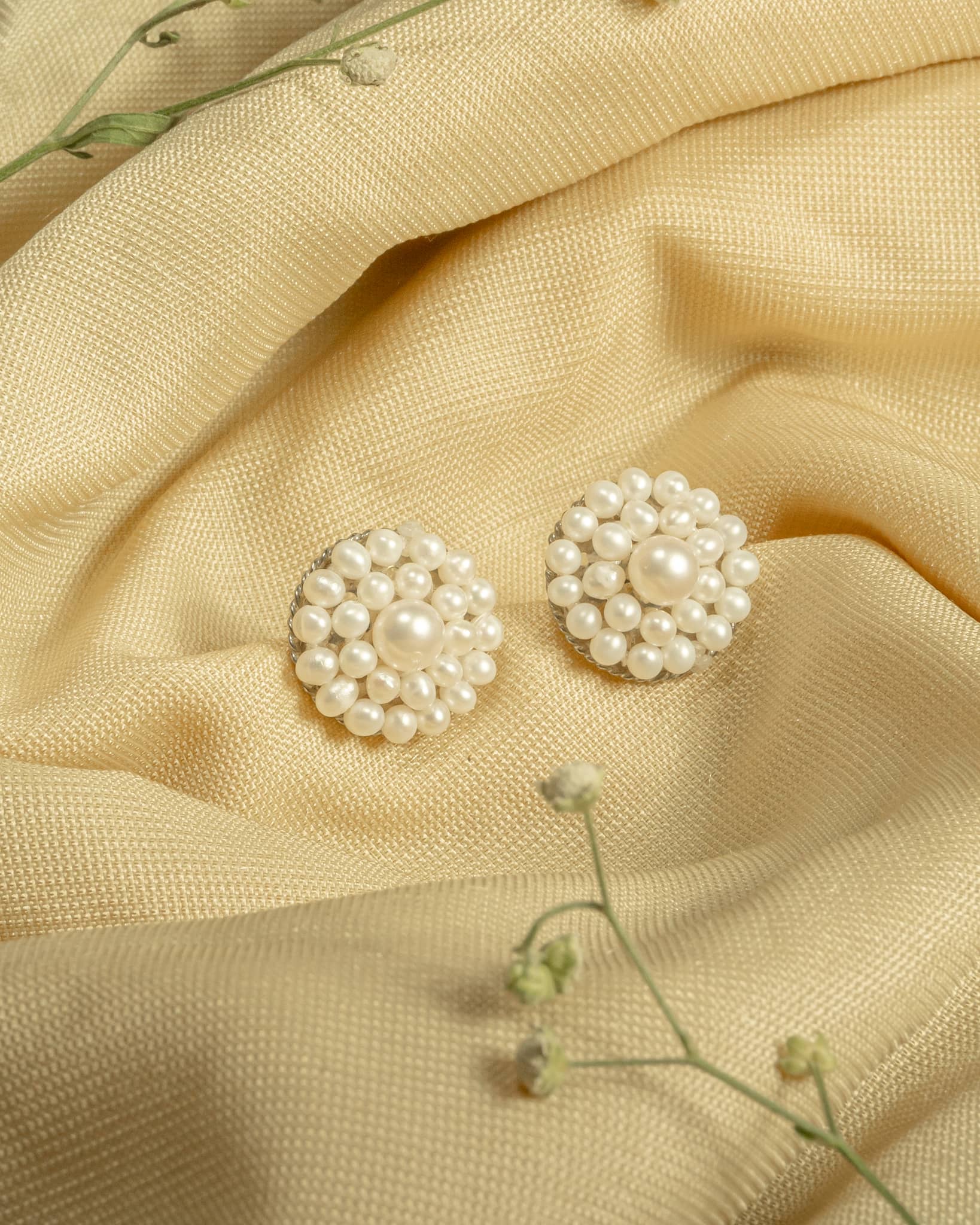925 sterling silver pearl cluster stud earrings featuring a floral design with small seed pearls.
