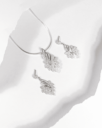 925 sterling silver pendant and earring set featuring a cascading leaf design with baguette and round CZ stones (chain not included).
