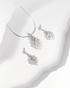 925 sterling silver pendant and earring set featuring a cascading leaf design with baguette and round CZ stones (chain not included).