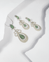 925 sterling silver pendant and earring set featuring emerald green teardrop stones surrounded by white CZ (chain not included).