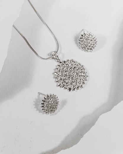 925 sterling silver round pendant and earring set featuring a sunburst mesh design (chain not included).