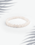 Dainty 6mm natural rose quartz and moonstone bracelet featuring small pink and white beads.