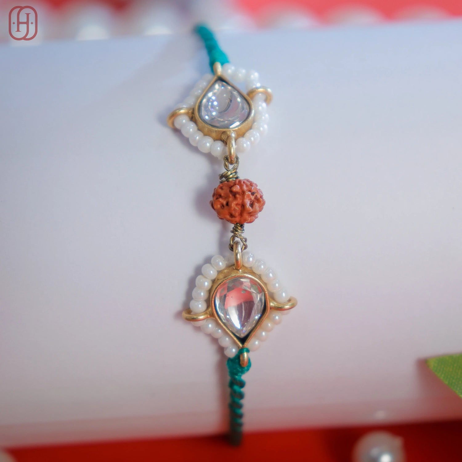 Designer Rudraksha Rakhi with 92.5 Silver Accents.