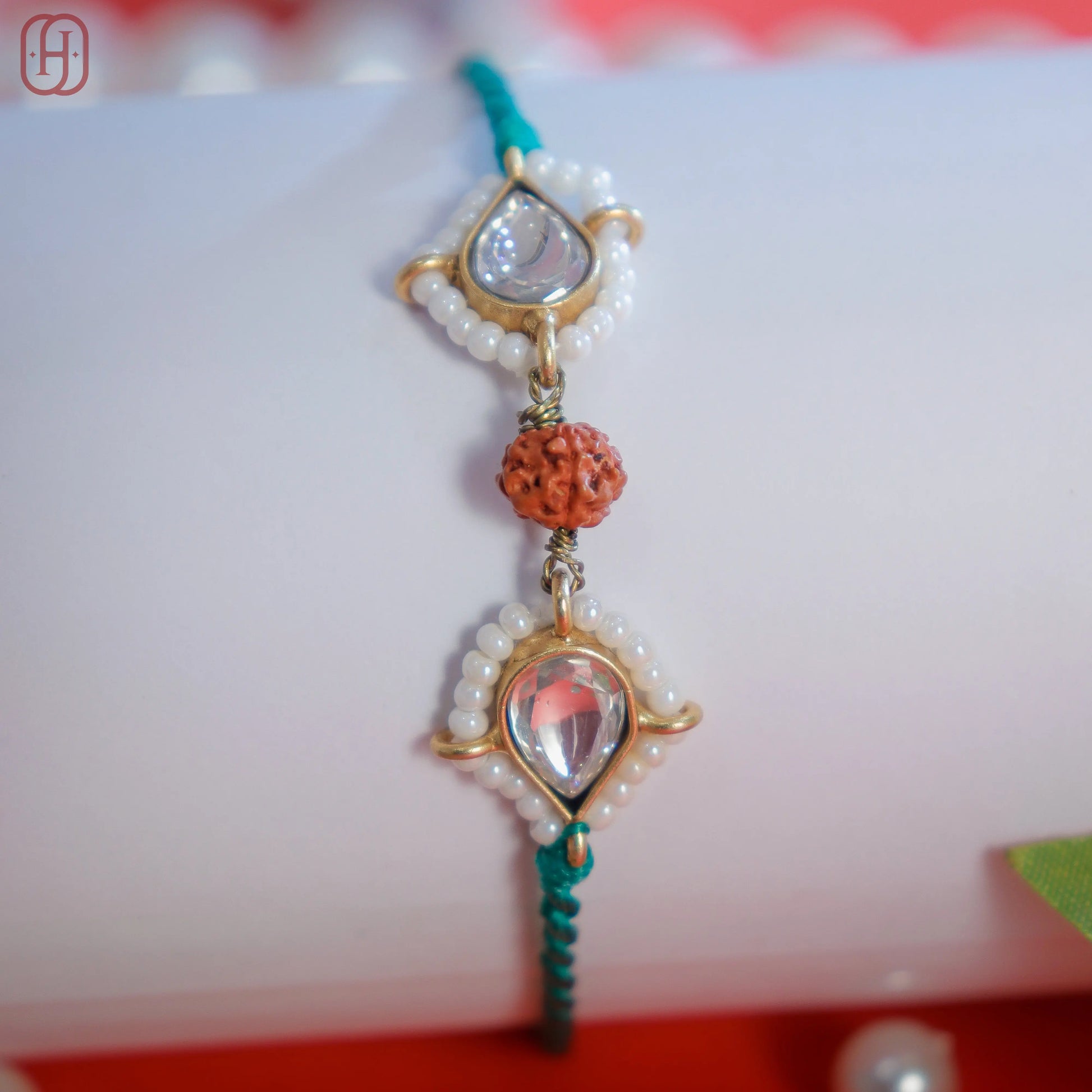 Designer Rudraksha Rakhi with 92.5 Silver Accents.