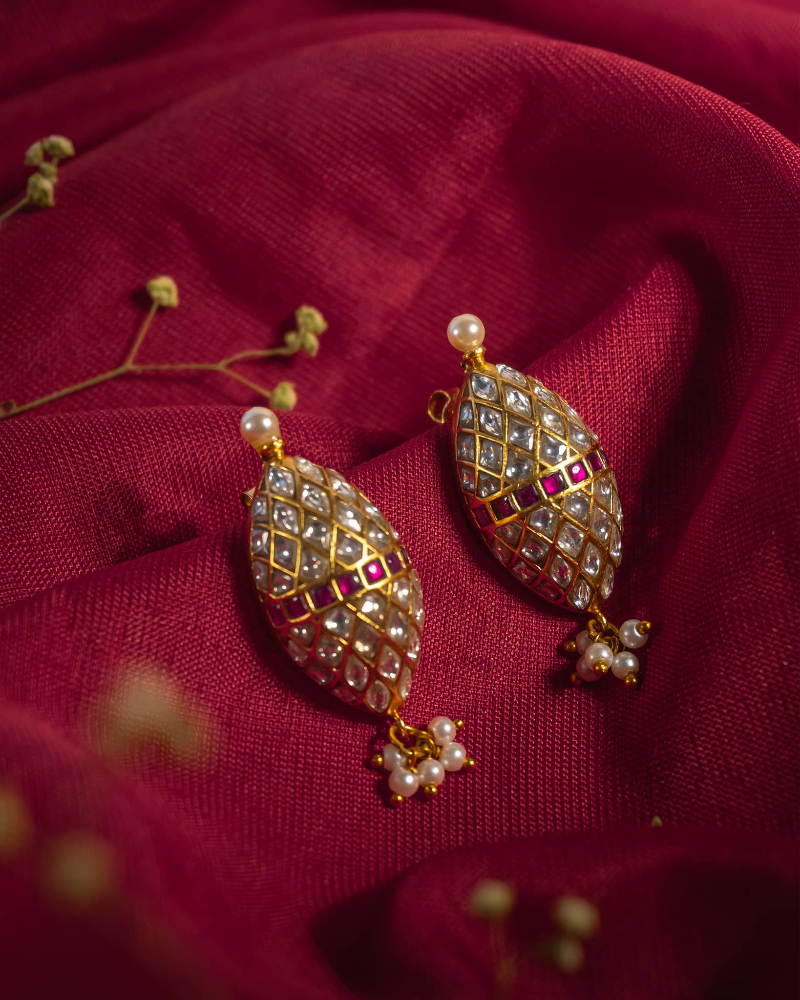 Gold plated 925 silver oval drop earrings featuring polki lattice pattern with ruby band and pearl drops.