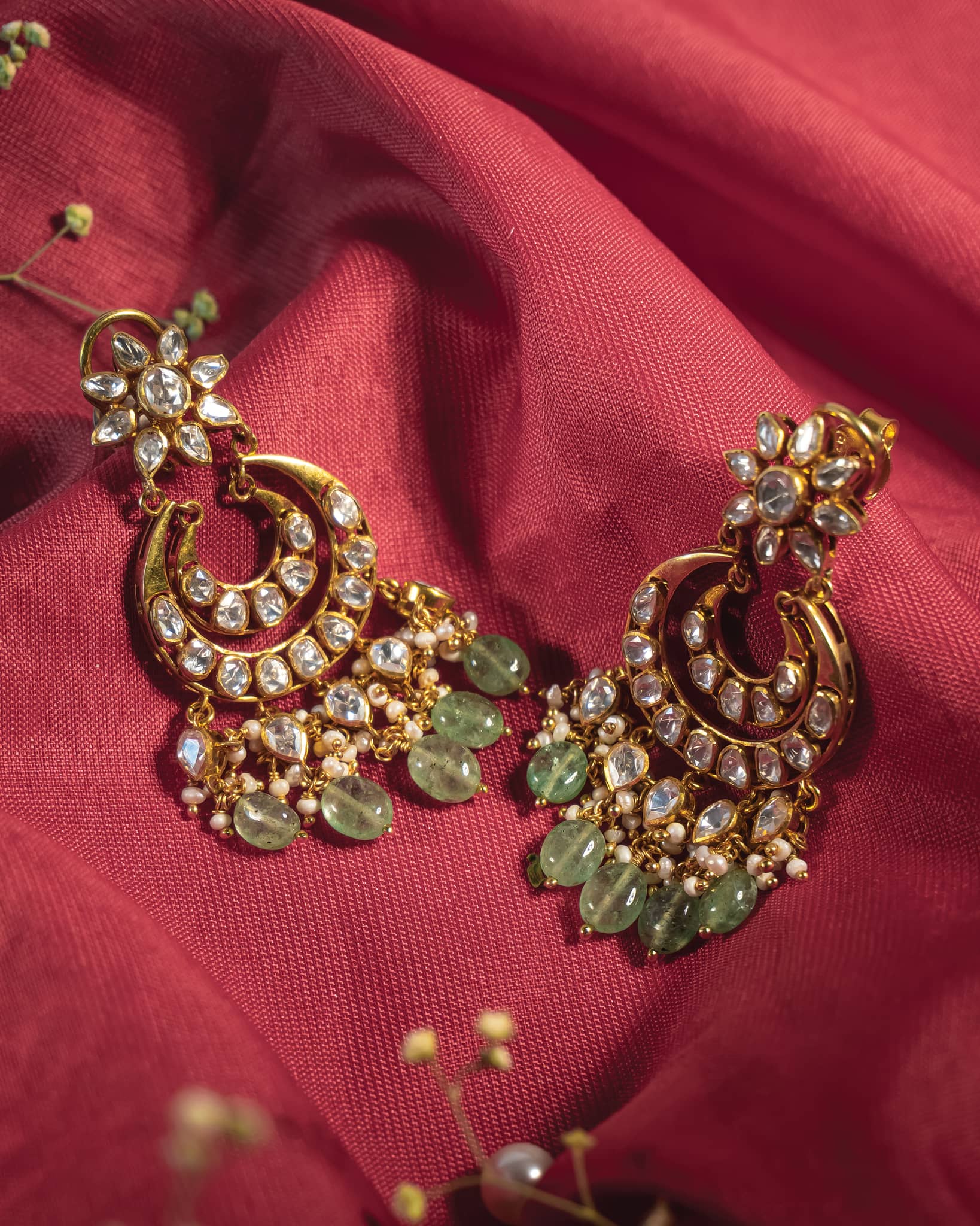 Gold plated polki chandbali earrings with mint green beads and pearl drops.