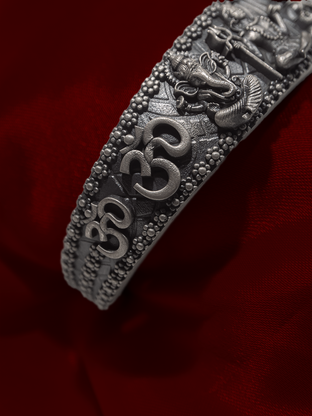 Broad silver temple nakshi kada carved deities and Om close up