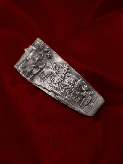 Broad silver temple kada for men close up of carved figures