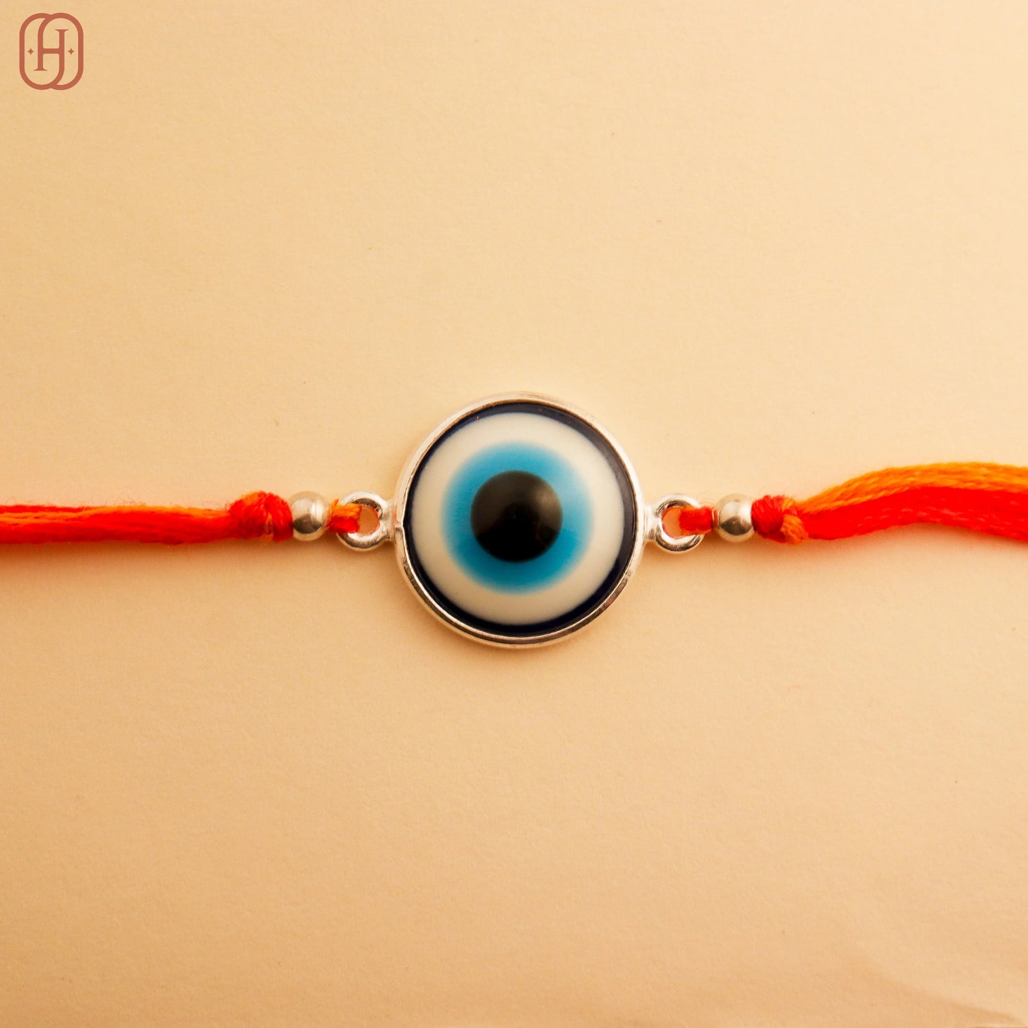 Handcrafted Sterling Silver Evil Eye Rakhi by Hardik Jewels.