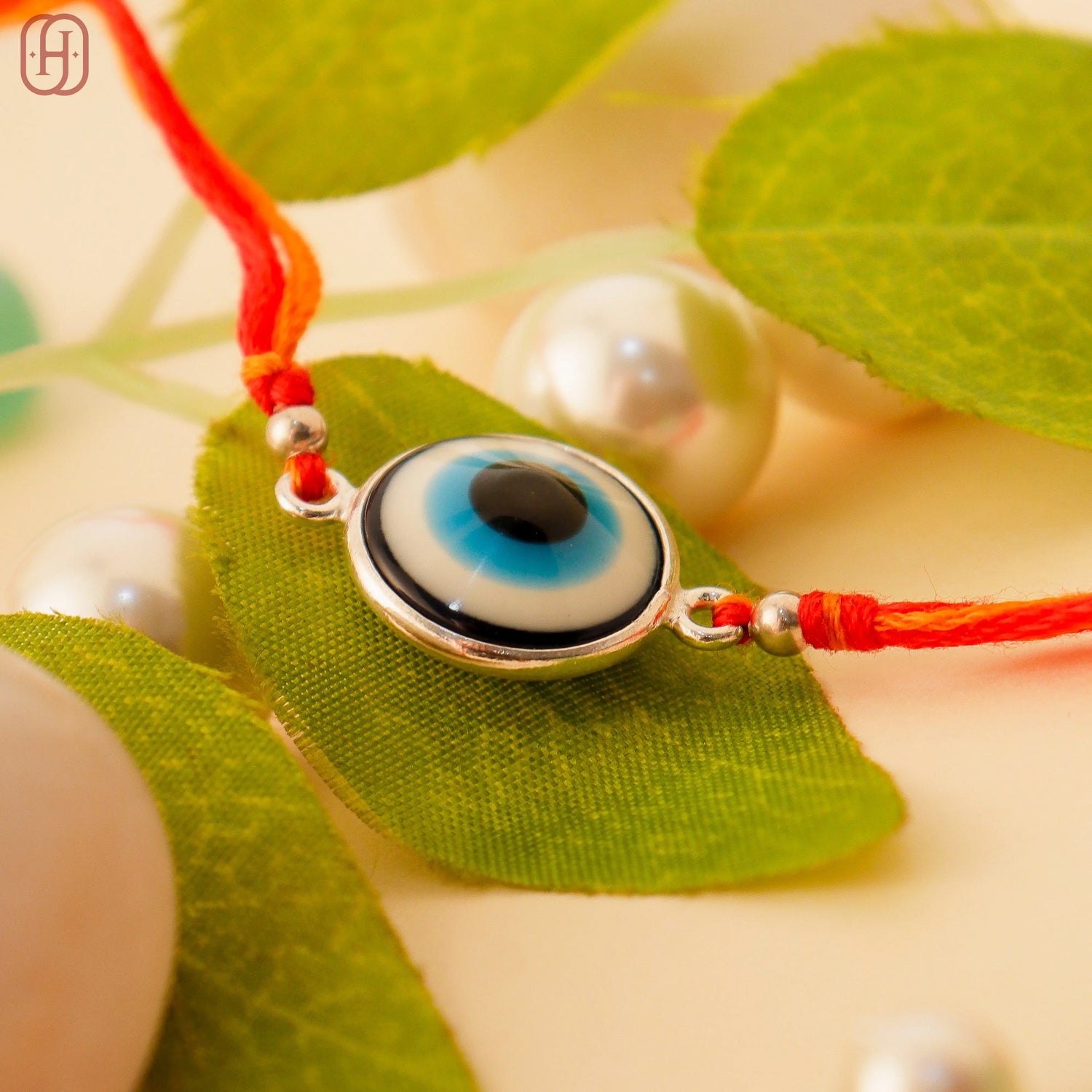 Handcrafted Sterling Silver Evil Eye Rakhi by Hardik Jewels.