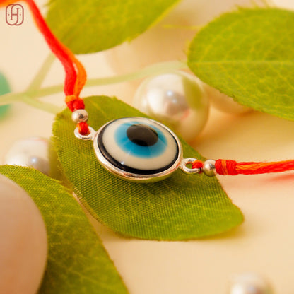 Handcrafted Sterling Silver Evil Eye Rakhi by Hardik Jewels.