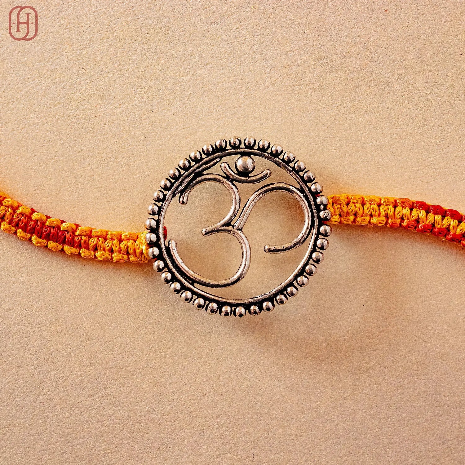 Hardik Jewels 92.5 Silver Om Rakhi - Handcrafted Design.