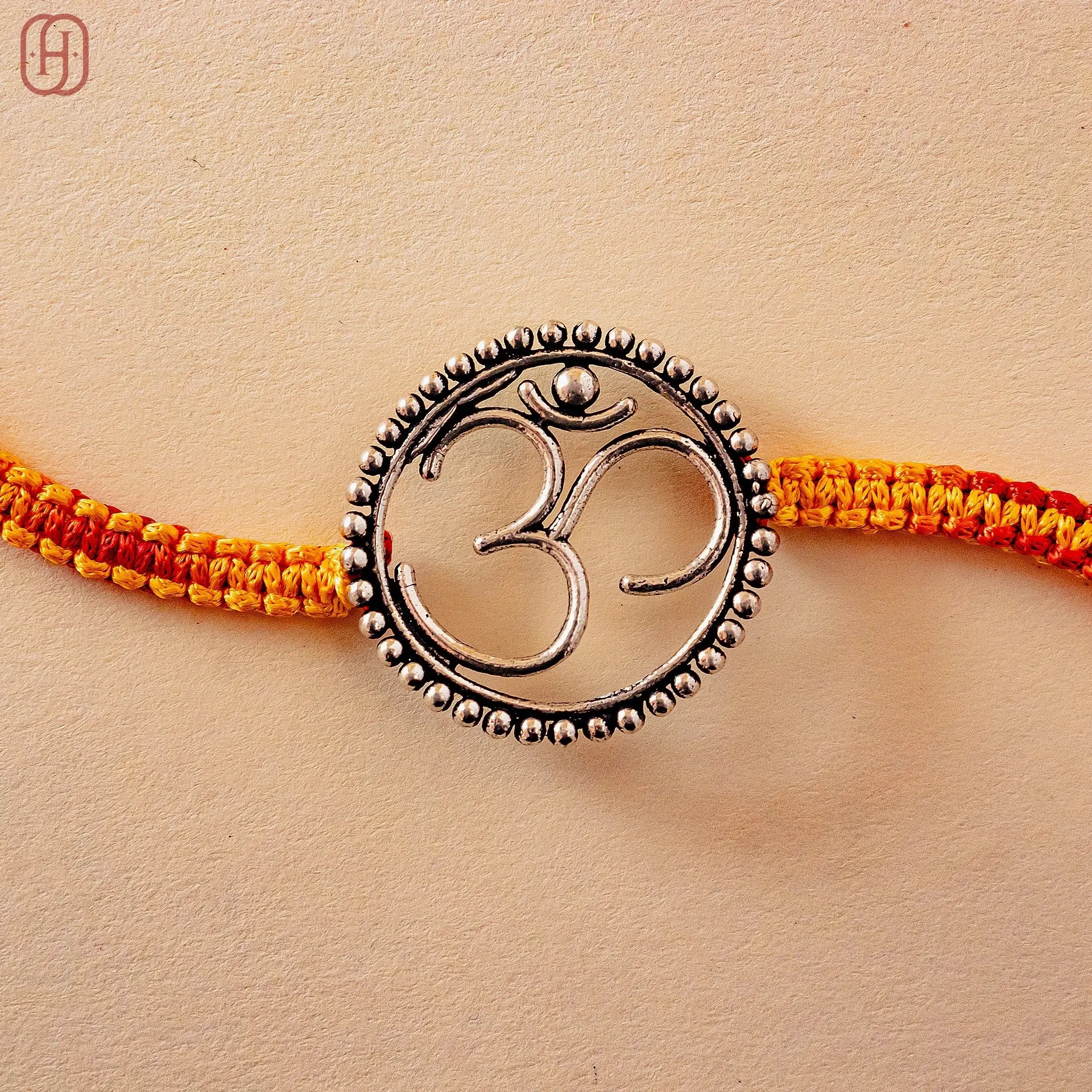 Hardik Jewels 92.5 Silver Om Rakhi - Handcrafted Design.