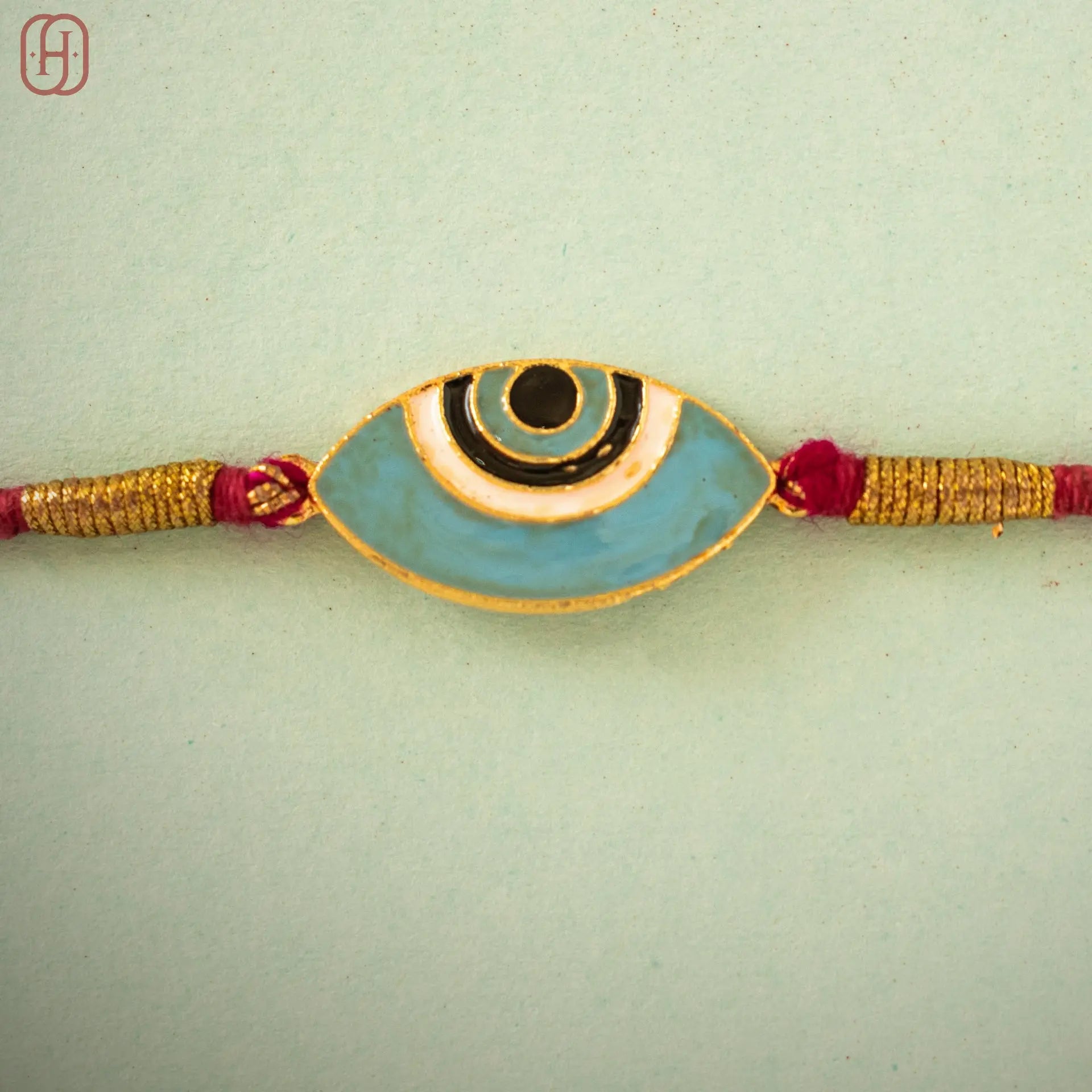 Hardik Jewels Evil Eye Silver Rakhi with Handcrafted Design.