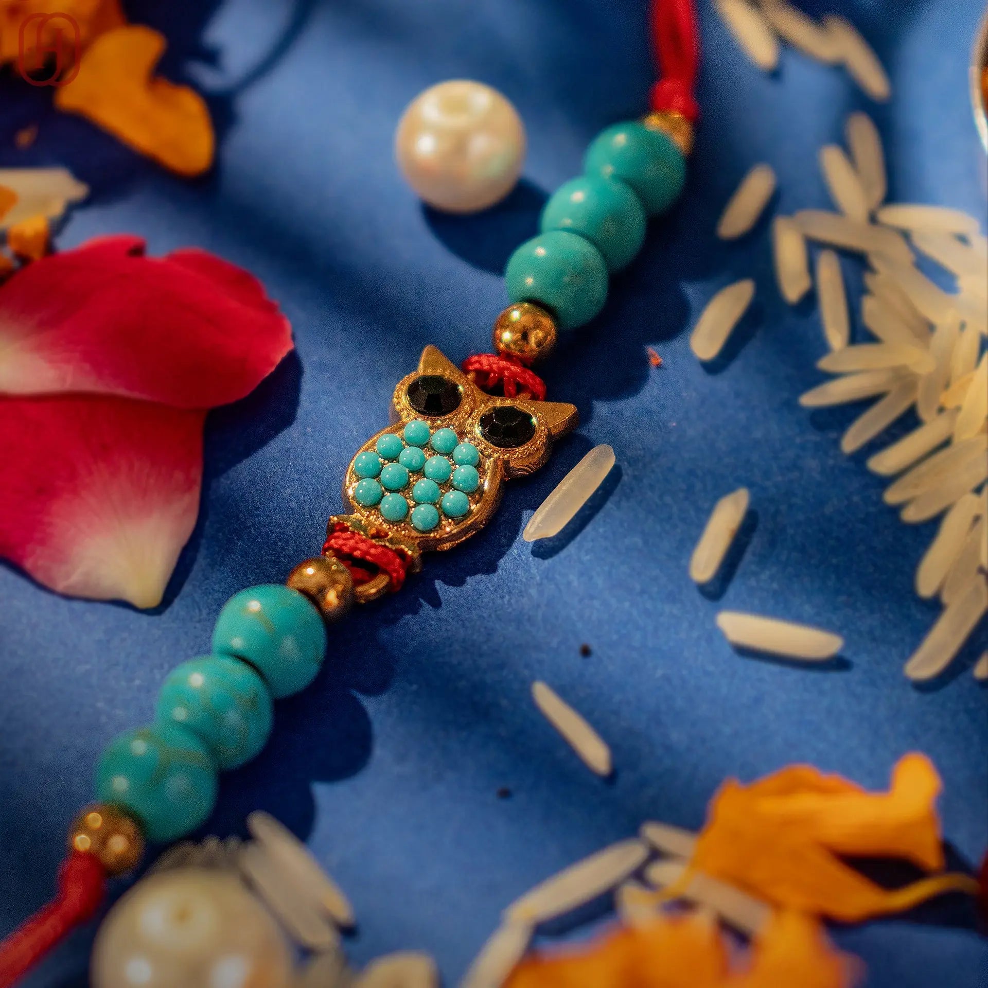 Hardik Jewels Handcrafted Owl Silver Rakhi with Turquoise Beads.