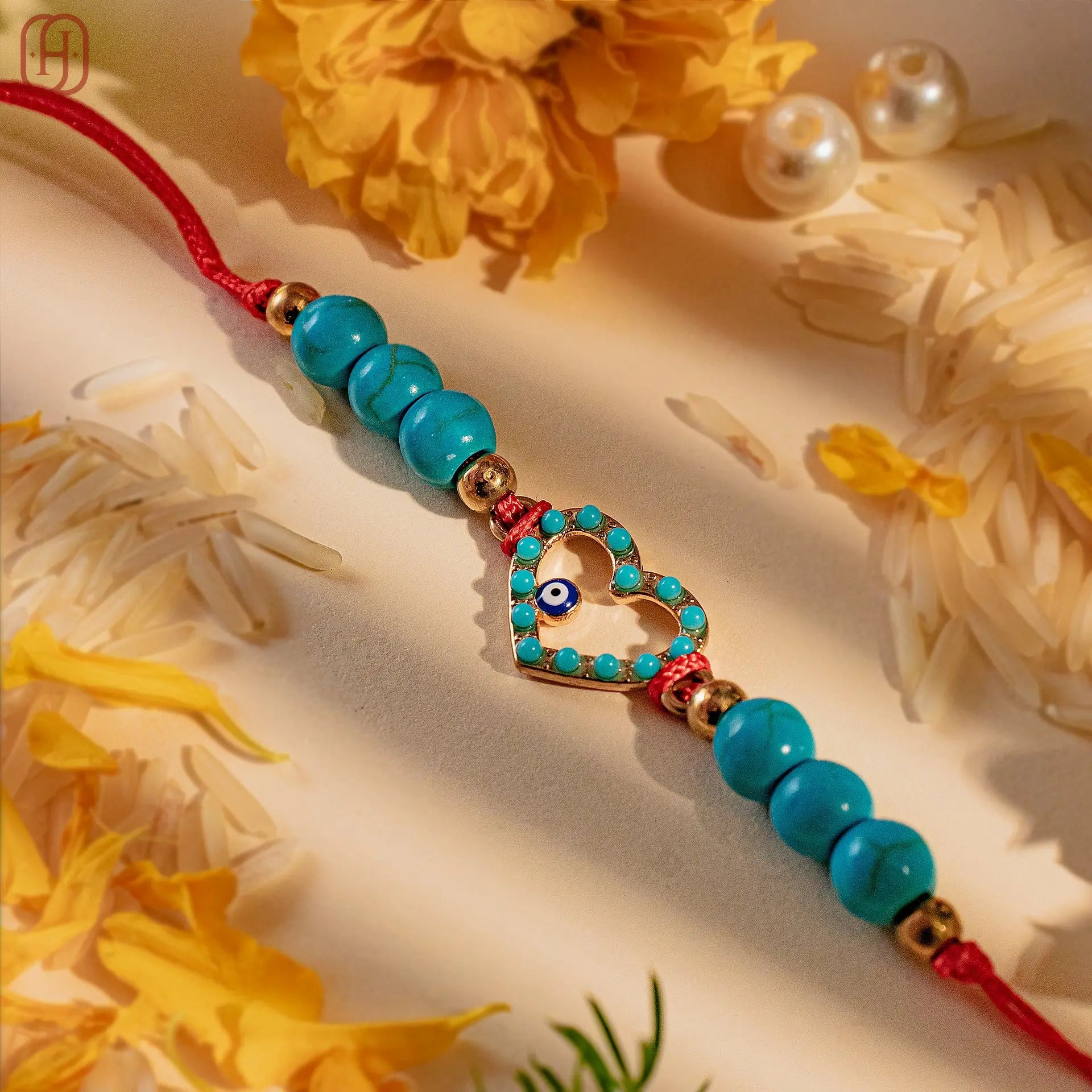 Hardik Jewels Heart Evil Eye Silver Rakhi with Blue Beads.