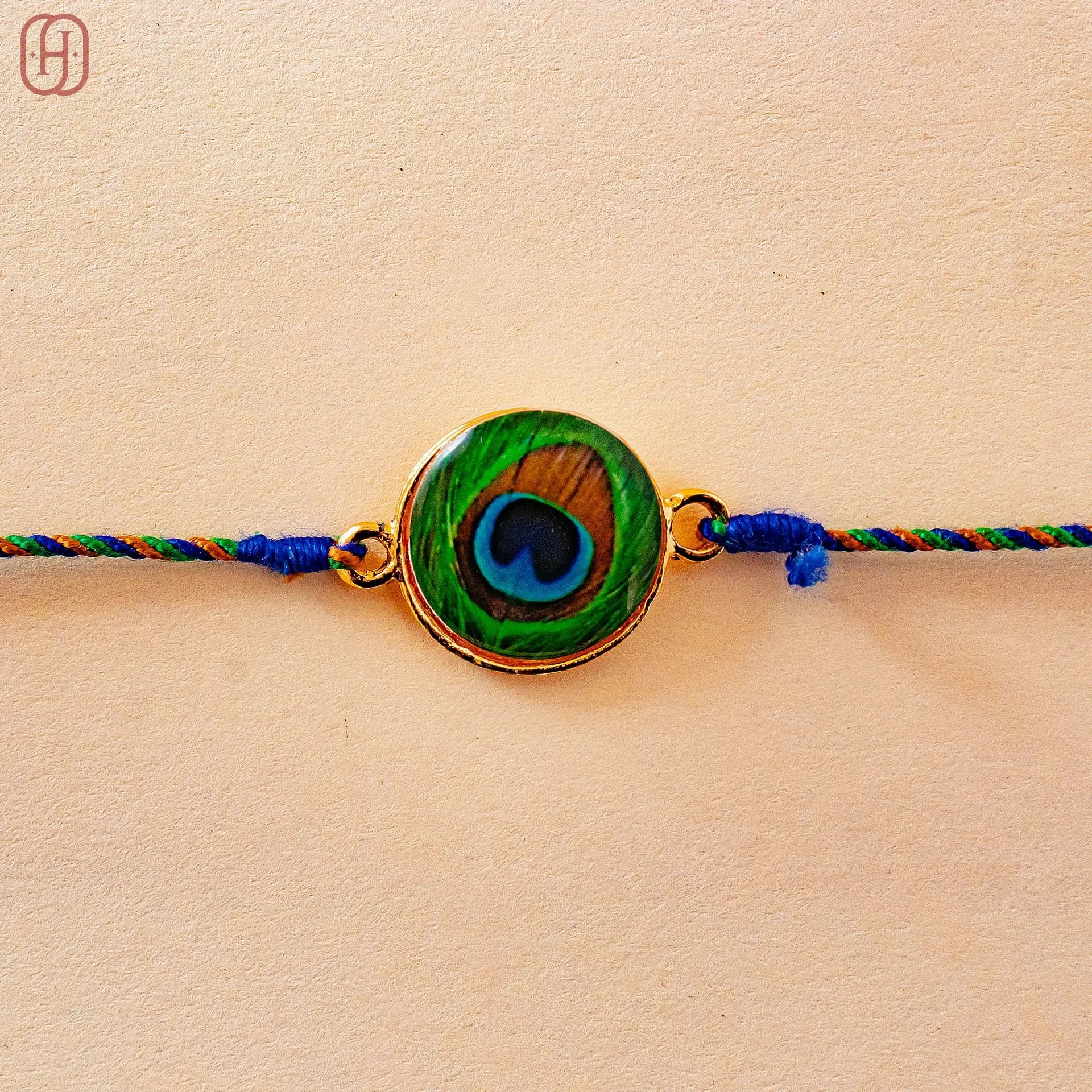 Hardik Jewels Peacock Rakhi Online - Elegant Silver Design.