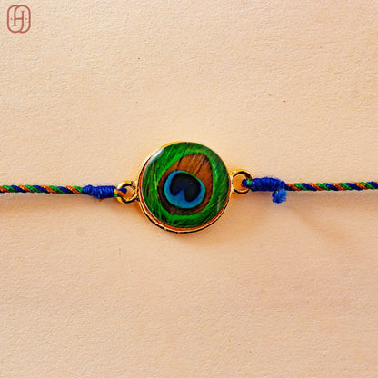 Hardik Jewels Peacock Rakhi Online - Elegant Silver Design.