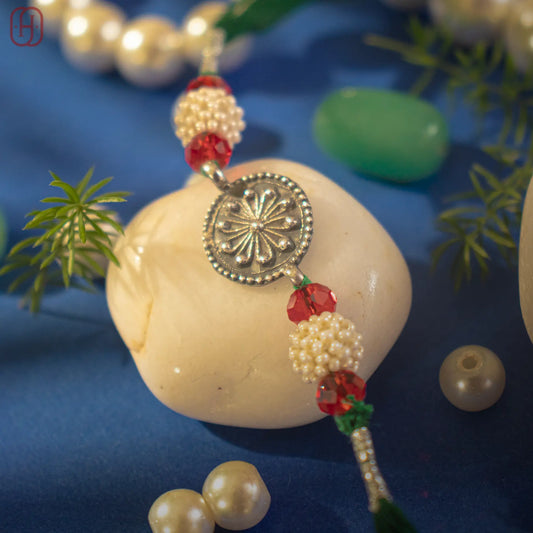 Hardik Jewels Pearl Bead Rakhi Silver - Handcrafted Elegance.