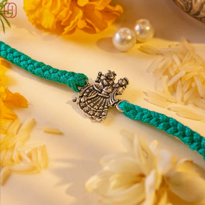 Hardik Jewels Radha Krishna Silver Rakhi for Celebration.