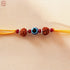 Hardik Jewels Rudraksha Evil Eye Rakhi with 92.5 Silver Beads.