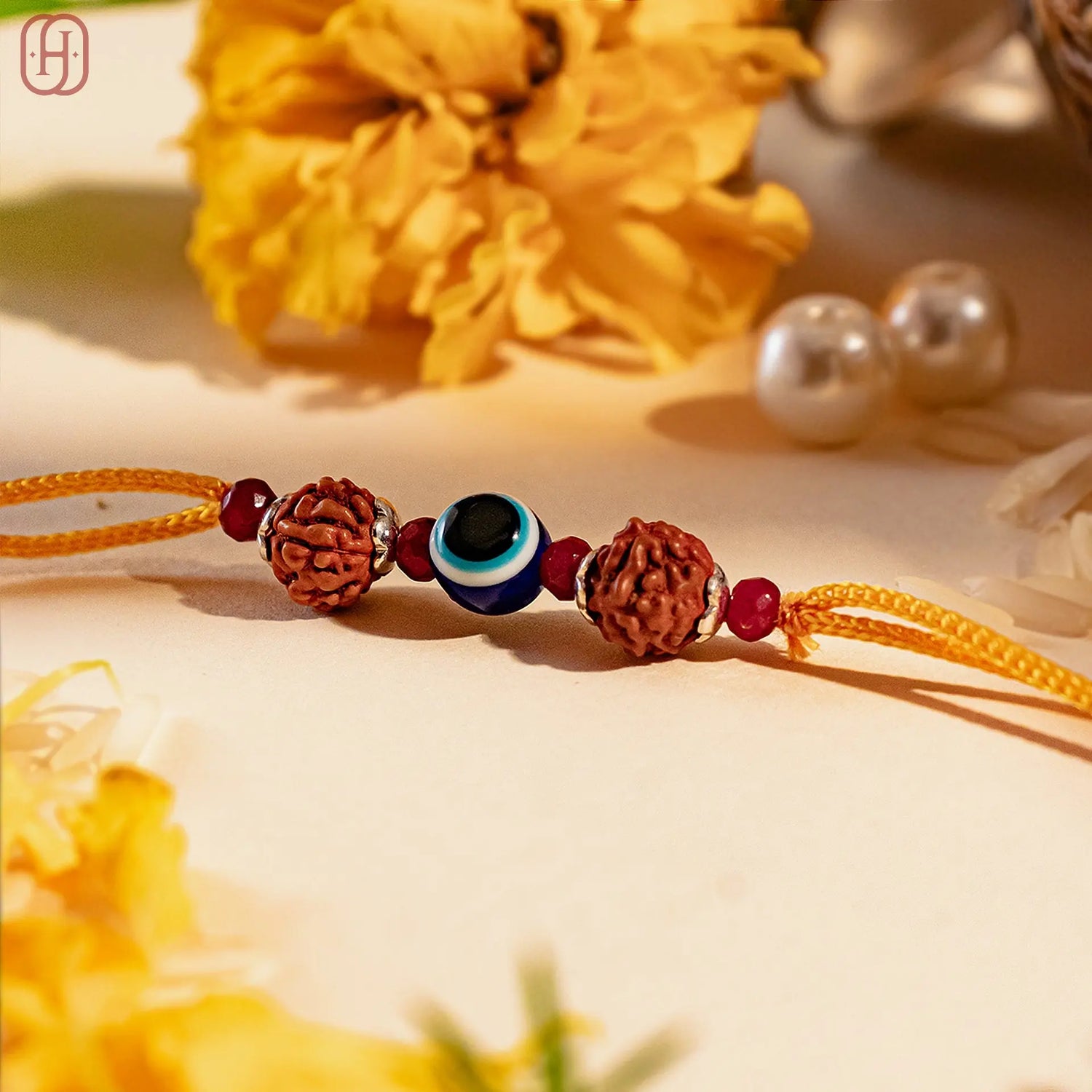 Hardik Jewels Rudraksha Evil Eye Rakhi with 92.5 Silver Beads.