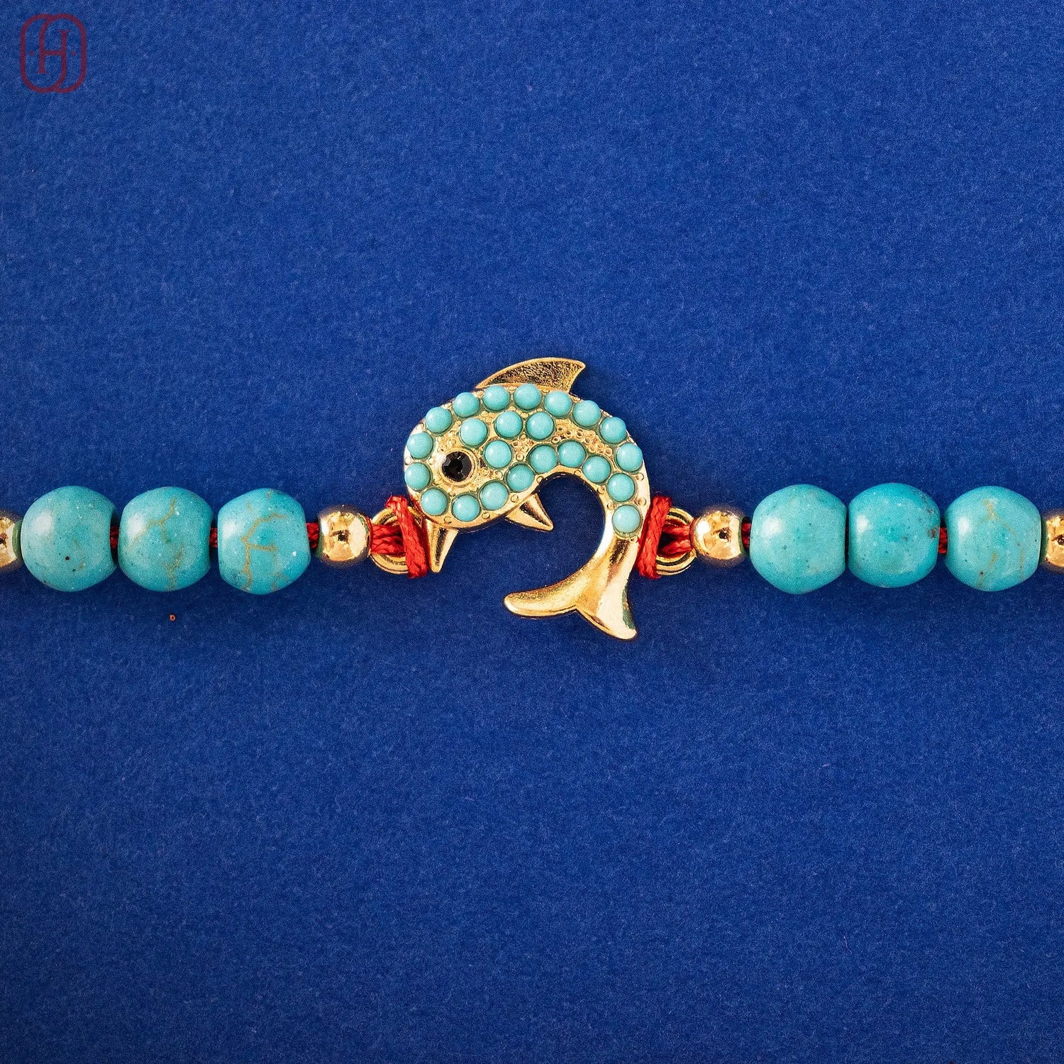 Hardik Jewels Silver Fish Rakhi with Turquoise Beads.